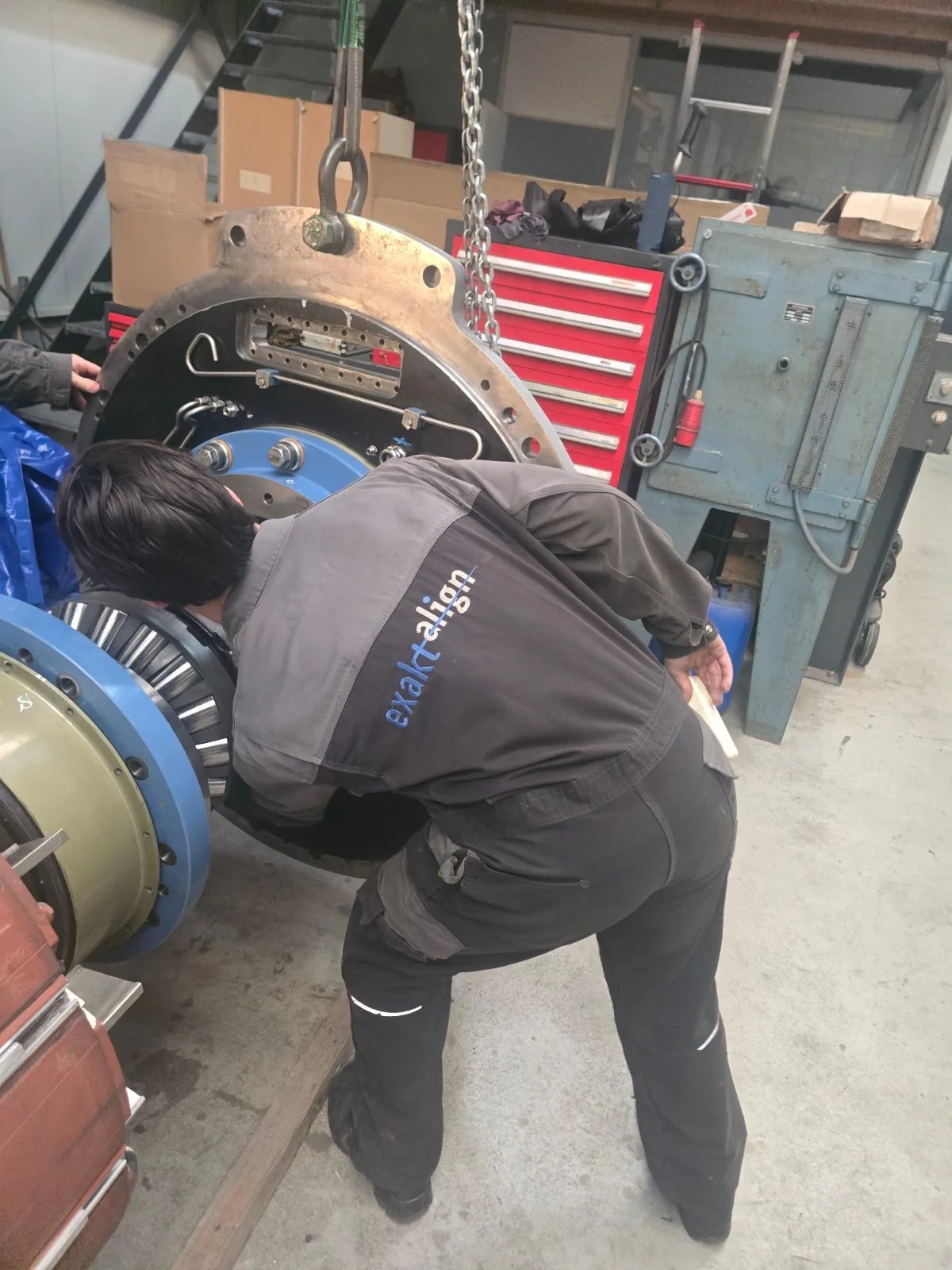 Marine engineer servicing propulsion system components